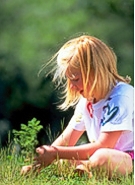 a young girl planting a tree - a gift that grows