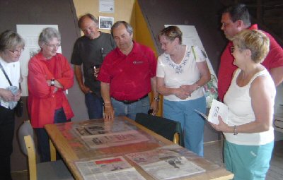 Mayor Rodriguez looks at items taken from the Walden Time Capsule